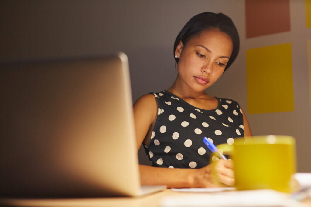 Woman writing in the office