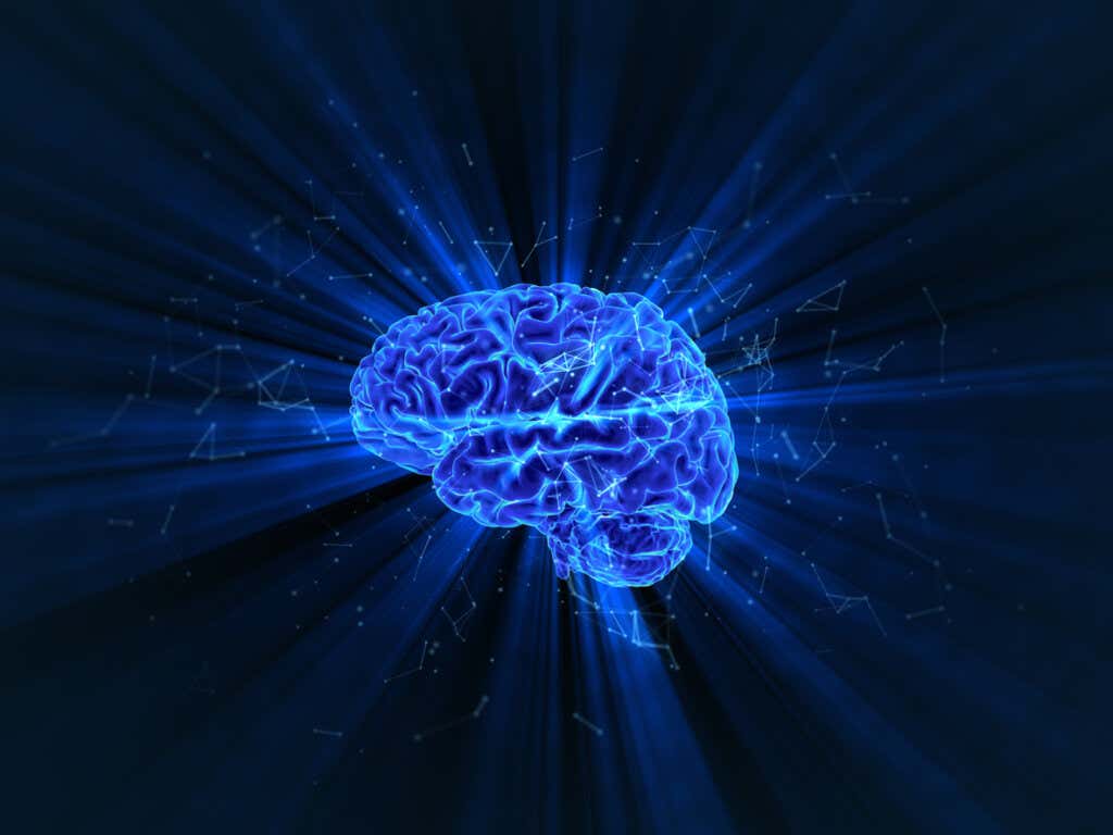 Cervello illuminato blu che simboleggia gli effetti della terapia psichedelica