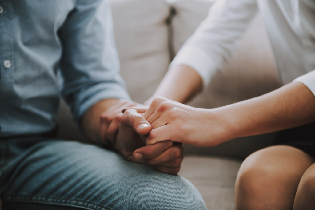 Hands of a couple holding