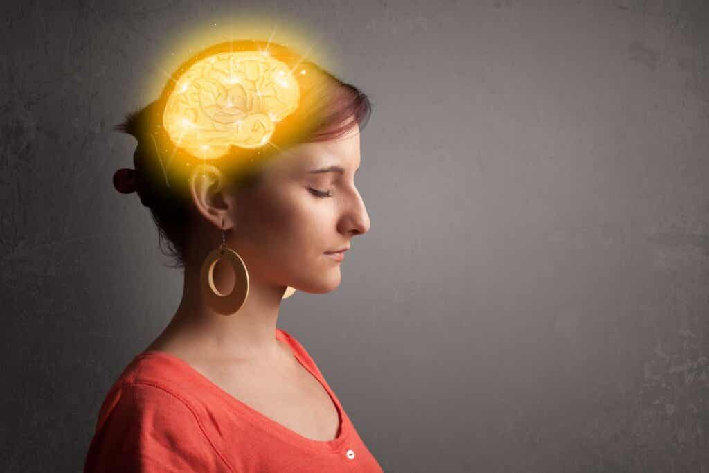 Woman with illuminated brain symbolizing emotional intelligence and critical thinking
