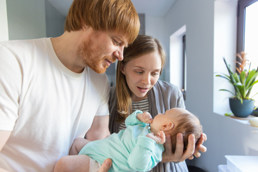 Parents talking to their baby