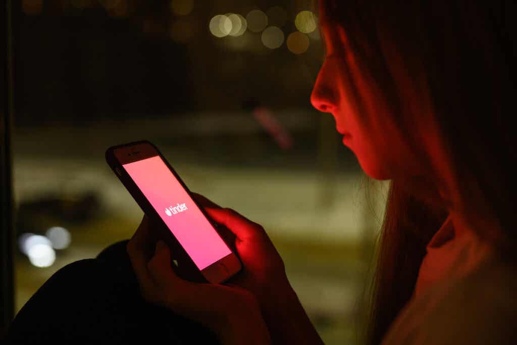Girl watching an app to flirt