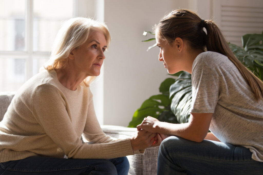 Daughter talking to her older mother