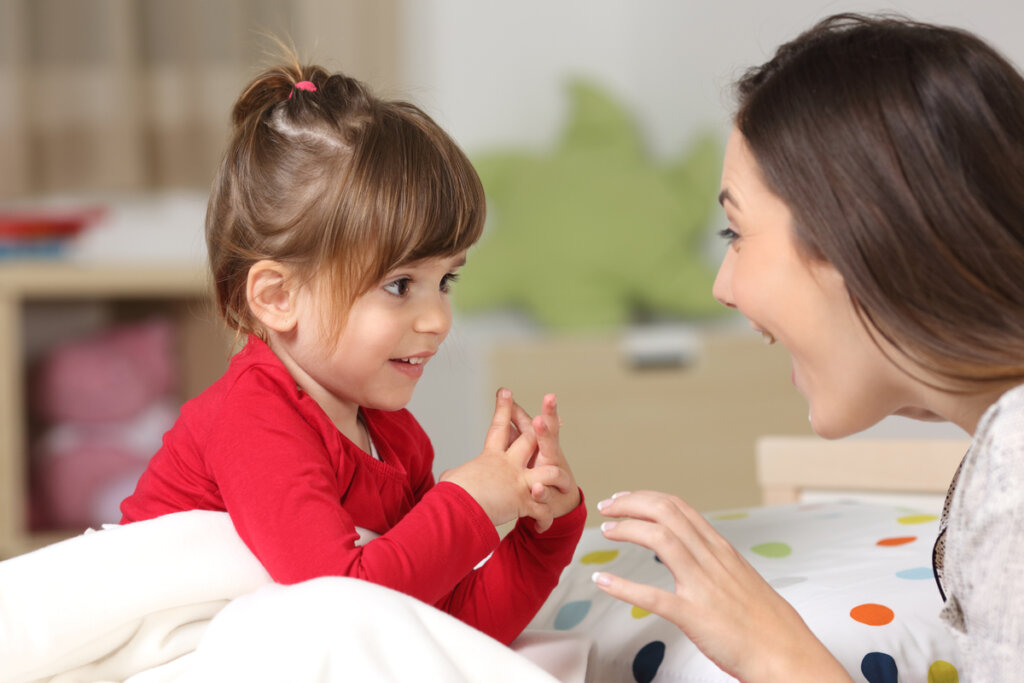 Mother talking to her little daughter