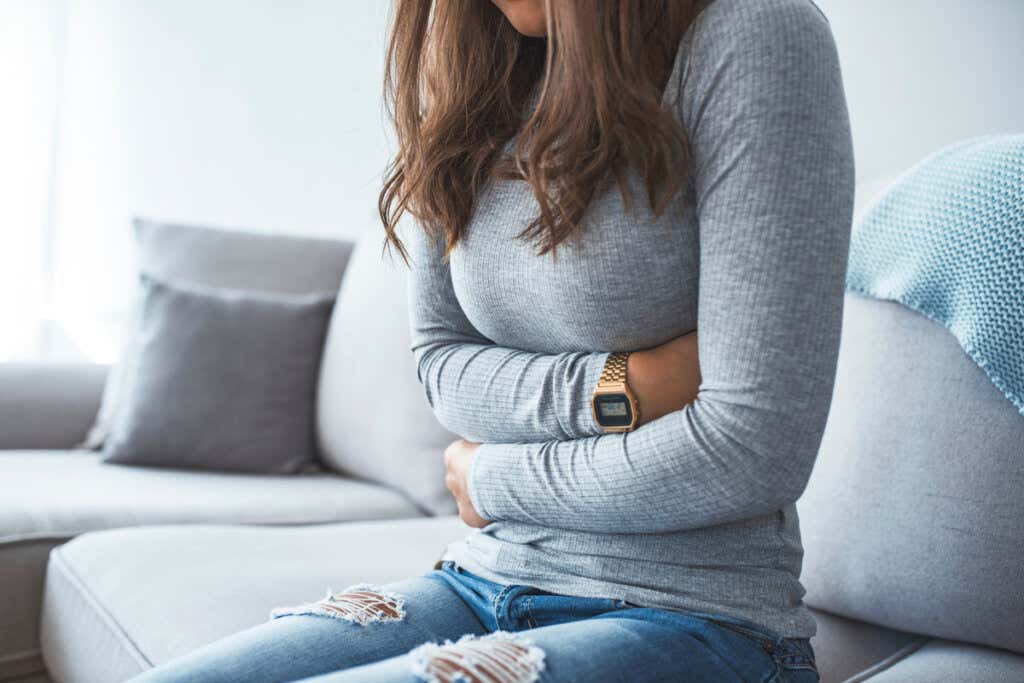 Woman with stomach ache from anxiety