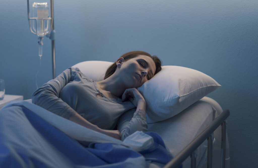 Sleeping woman in hospital, representing what gives hope to the sick.