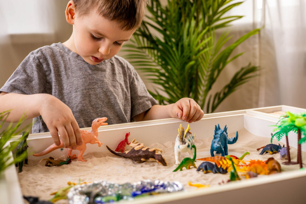 Boy playing with a sandbox