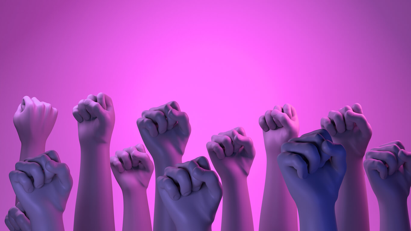 Manos empuñadas simbolizando que la violencia no puede encubrirse y es hora de levantar la voz