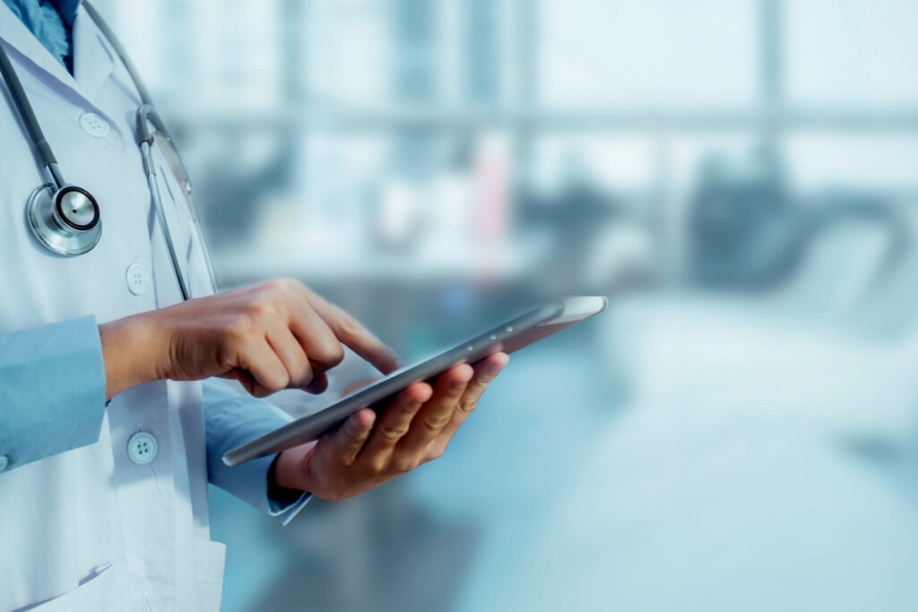 Doctor looking at a tablet