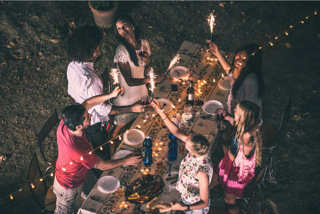 Friends having dinner at night