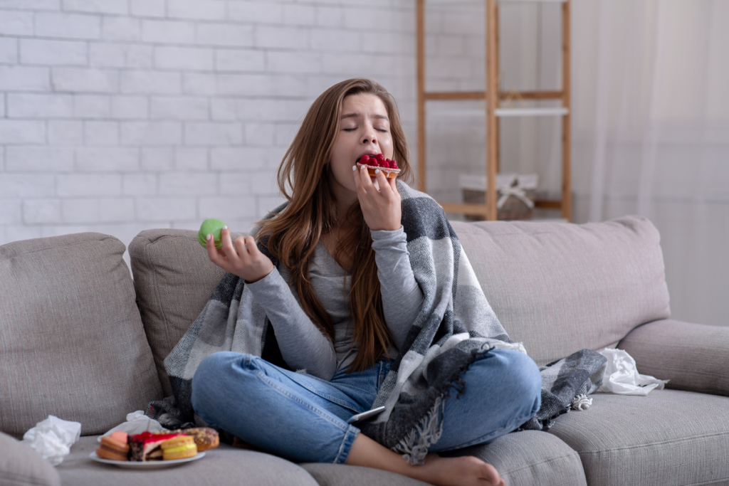 Girl eating a lot symbolizing one of the types of avoidance