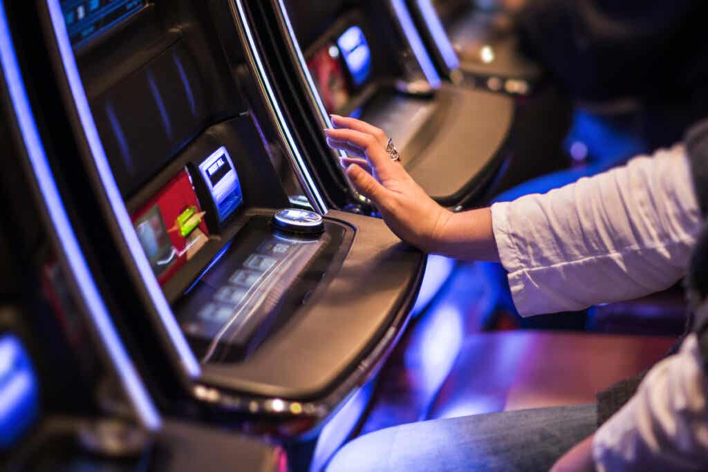 Person playing slot machines