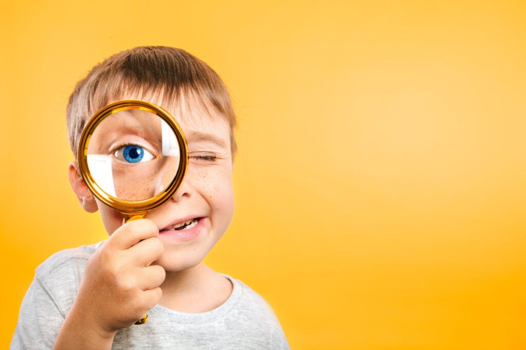 boy with a magnifying glass