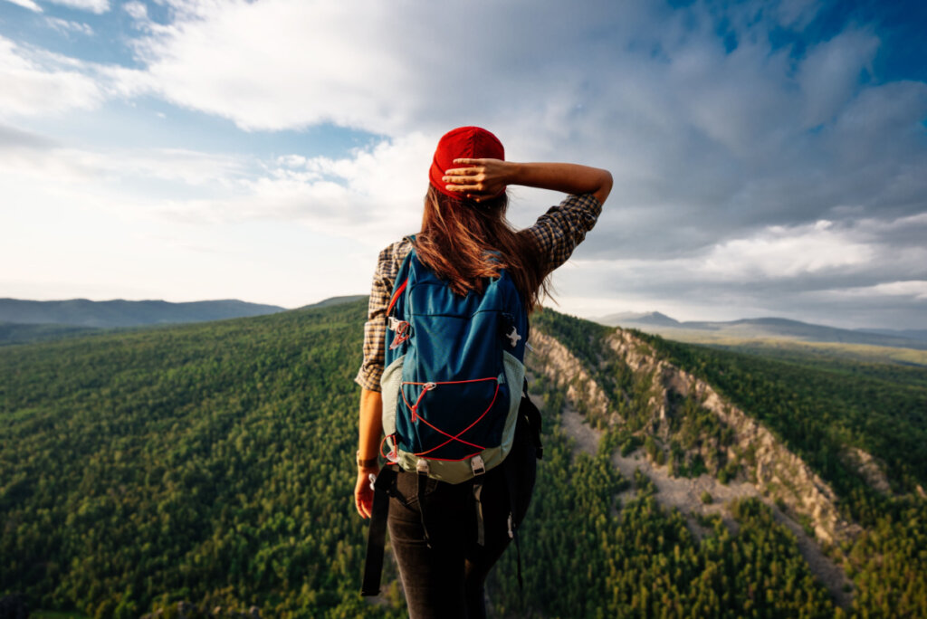 Woman on the mountain thinking about the adaptability quotient