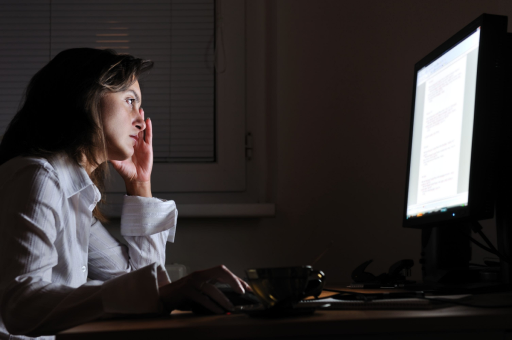 Woman at the computer at night