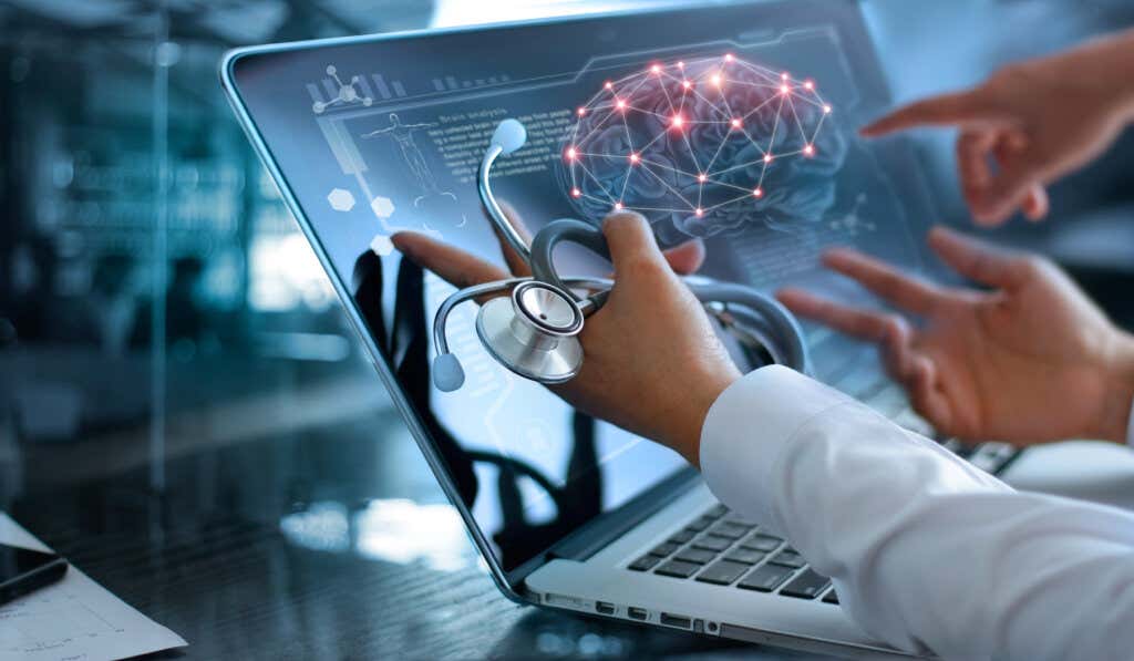 Computer with brain and stethoscope symbolizing the impact of neurotechnologies