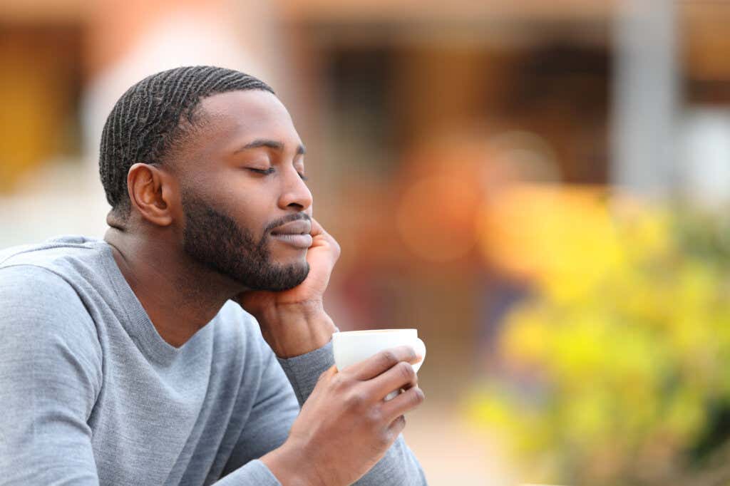 Man drinking coffee and enjoying the moments of life