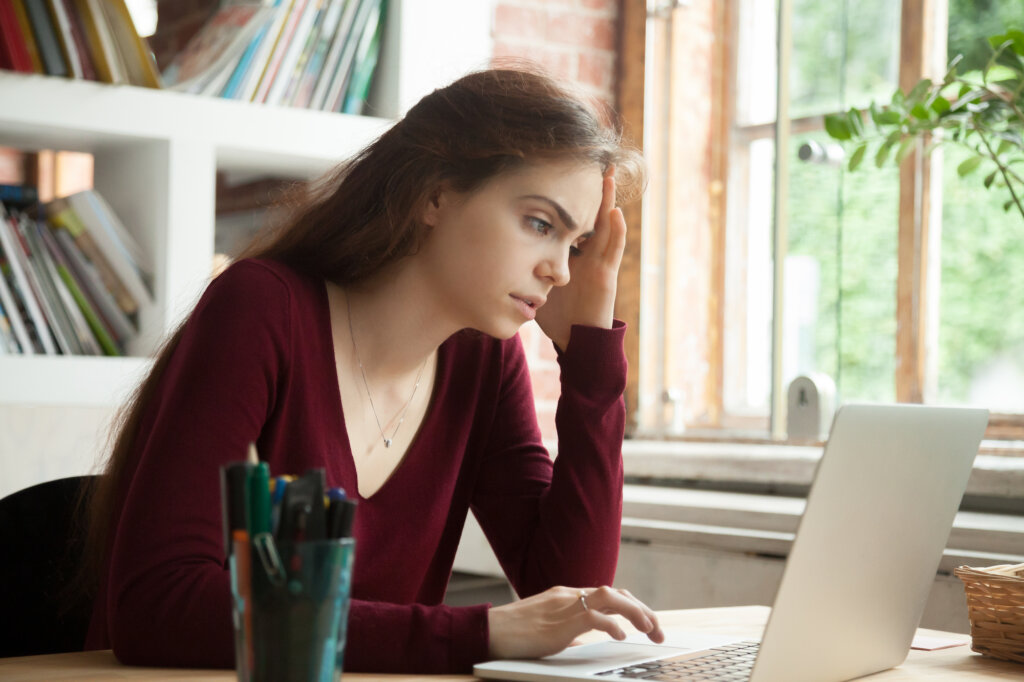 Exhausted woman in front of the computer