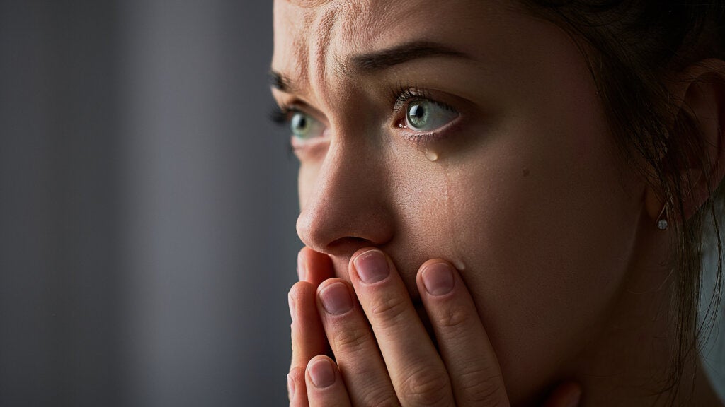Woman crying because she is going through mental pain