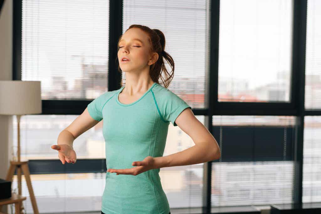 Woman performs breathing exercises
