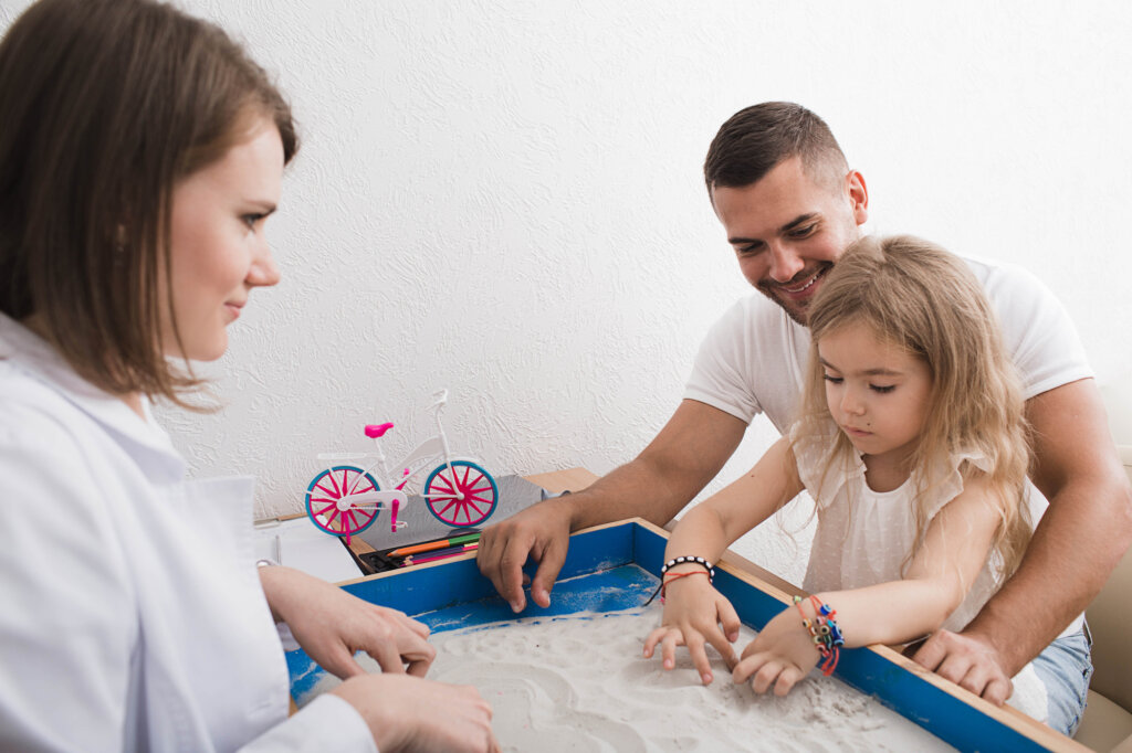 Parents with their daughter during play therapy