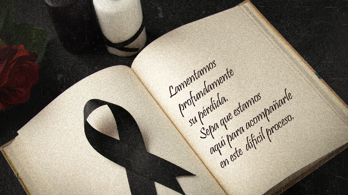 Condolencias formales escritas en un libro junto a un lazo de luto